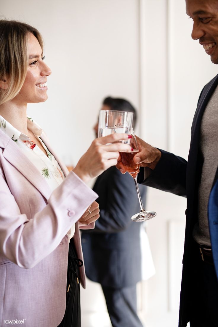 Business people making a toast at an office party…